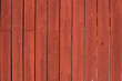 Traditional classic swedish red paint on wooden wall.