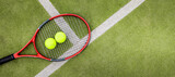 tennis balls and racket on green synthetic grass court background. top view with copy space