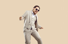 Overjoyed Businessman In Suit And Glasses Isolated On Nude Brown Studio Background Celebrate Win Or Success. Smiling Man In Formalwear Scream And Shout Feel Euphoric Excited With Promotion.