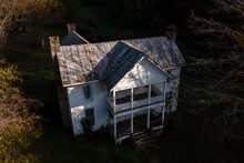 Abandoned Clapboard Sided House On Rural Farm With Two Story Front Porch - Appalachian Mountain Region - West Virginia