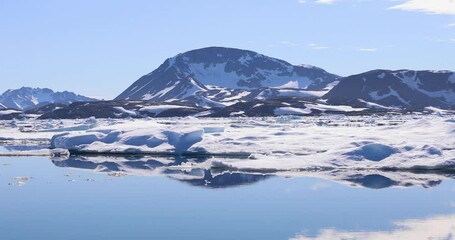 Wall Mural - a rigid inflatable boat powers across the glacier lagoon at kulusuk, greenland - the result of globa