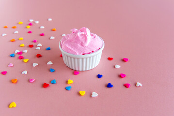 confectionery, whipping cream on pink background.