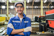 Portrait of Asian industrial worker man working in manufacturing plant
