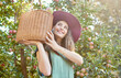 © Jade M/peopleimages.com - One happy farmer holding basket of freshly picked apples from tree on sustainable orchard farm outside on sunny day from below Cheerful farmer harvesting juicy nutritious organic fruit in season