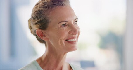 Canvas Print - Happy mature woman looking thoughtful and smiling while standing inside with copyspace. Face of pensive lady looking away and planning her future, thinking of an idea or happy past memories