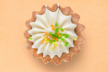 Sticker - Tartlet cake on beige background