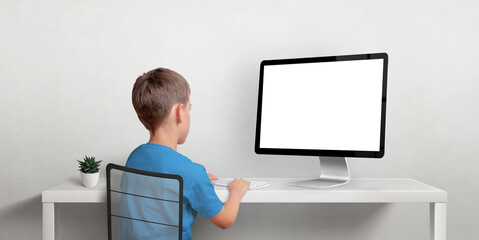 Leinwandbilder - Boy working on the computer mockup. Isolated displaz screen for web page promotion. Back view of boz and work desk