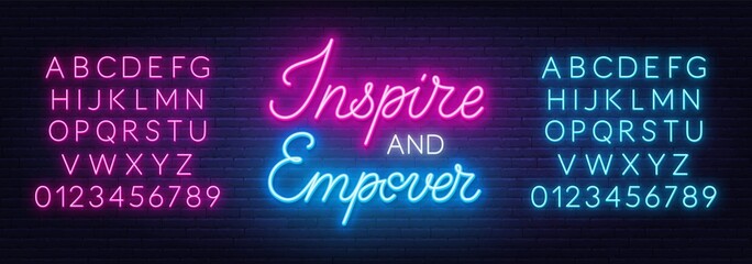 Wall Mural - Inspire and Empower neon sign on brick wall background.
