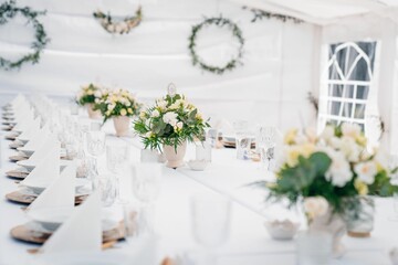 Designed white table for the event with special decoration