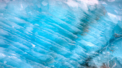 Wall Mural - a close-up of the layered surface of a blue glacier - knud rasmussen glacier near kulusuk - greenlan
