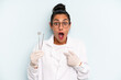 © kues1 - hispanic woman looking shocked and surprised with mouth wide open, pointing to self. dentist concept