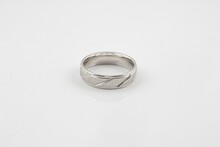 Closeup Of A Silver Ring With Simple Patterns Isolated On A White Background