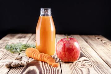 Wall Mural - bottle of carrot and apple juice with ginger. healthy eating