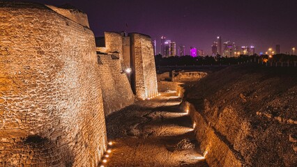 Poster - Bahrain Fort - a Unesco World Heritage Site - pictured against the backdrop of the Seef Skyline