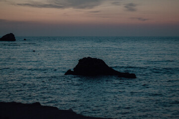 Wall Mural - sunset over the rocky ocean in greece