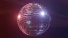 Rotating Mirror Disco Ball In Red And Blue Pulsing Light, Seamless Loop In Prores 4K UHD