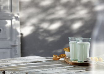 Sticker - Fresh milk on retro table and wall with morning shadows. 