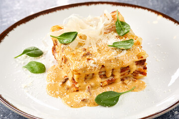 Wall Mural - .Traditional homemade italian lasagna with tomato sauce