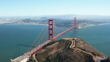 Aerial cinematic shot of Golden Gate Bridge and San Francisco skyline, Bay Area