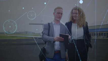 Poster - Animation of connections and lights over caucasian businesspeople with tablet at airport