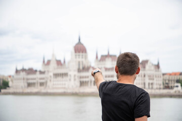 Wall Mural - tourist in Budapest parliament building in background