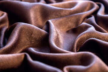Chocolate colored fabric background, backdrop or elegant wallpaper design.