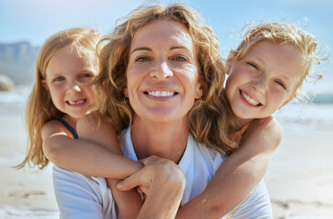 Sticker - Portrait of a cheerful mature woman and little girls enjoying family time at the beach on vacation. Happy sisters smiling with adopted mother, grandma or foster parent, enjoying fresh summer air