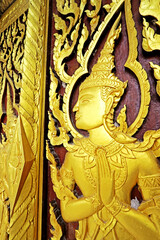 Wall Mural - Decorative of wood carving on the door in Thai temple