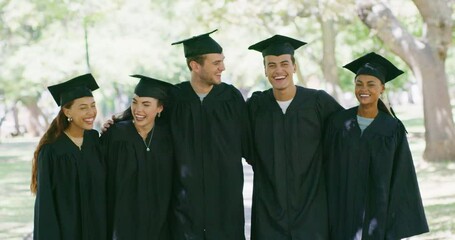 Wall Mural - Portrait of a group of university or college graduates in mortarboards and gowns standing outside together at their graduation ceremony. Proud students taking photos after their educational success