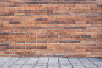 New red and brown brick wall with grey tile floor. Stonewall wallpaper with the ground