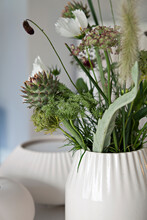 Green Flower Bouquet In White Porcelain Vase