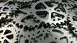 Steel gears on the grey background.