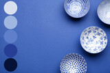 Fototapeta Dmuchawce - Beautiful Chinese bowls on blue background. Different color patterns