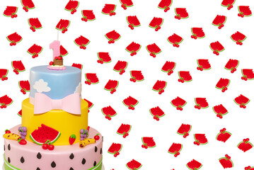 Wall Mural - fruit-themed cake decorated for a first-year children's party with watermelons in background.