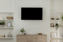 Stylish TV Set Mounted On Wall In Room