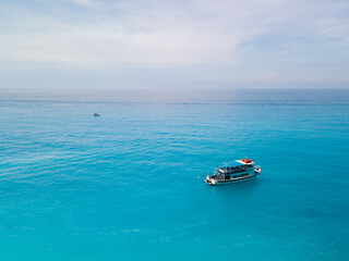 Wall Mural - aerial view of small cruise boat near lefkada island