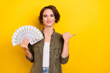 Photo Of Young Lovely Girl Indicate Finger Empty Space Ads Suggest Proposition Money Isolated Over Yellow Color Background