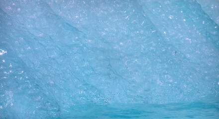 Wall Mural - a close-up of the layered surface of a blue glacier - knud rasmussen glacier near kulusuk - greenlan