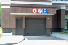 Closed Entrance To The Underground Parking Equipped With Video Surveillance And Road Signs.