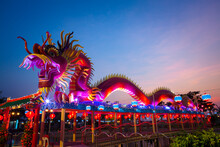 Night View Of Full Color Lighting Decorate On Dragon Statue, Chonburi Province, Thailand.
