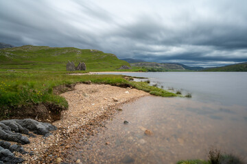 Wall Mural - long exposure view of the Calda House ruins on Loch Assynt in the Scottish Higlands