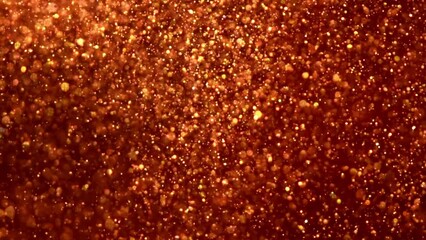 Wall Mural - Slowly Falling golden particles in red fluid. Gold dust particles and bokeh move slowly in red liquid. Abstract moving relaxing footage can be used as background or screensaver