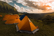 Tents at base camp at sunrise, golden hour