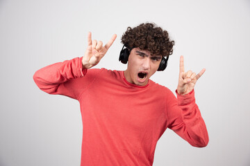 Wall Mural - Handsome man listening to rock music