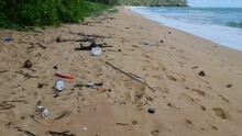 Plastic Waste On The Beach Of Phuket Thailand , Monsoon Season Al Waste From The Ocean Come Back. Plastic Botles And Other Waste On The Beach