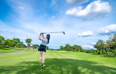 Sticker - Professional woman golfer teeing golf in golf tournament competition at golf course for winner