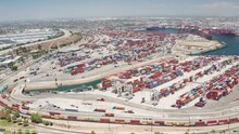 Aerial Orbit Shot Of Cargo, Freight, Shipping Containers In Los Angeles Harbor
