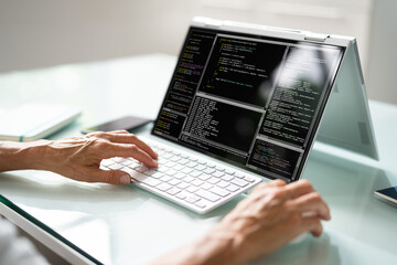 Programmer Or Coder At Office Desk
