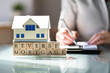 House Model Over Reverse Mortgage Blocks