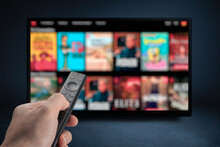 Tv Online. Television Streaming Video. Male Hand Holding TV Remote Control. Multimedia Streaming Concept. VoD Content Provider. Video Service With Internet Streaming Multimedia Shows, Series.